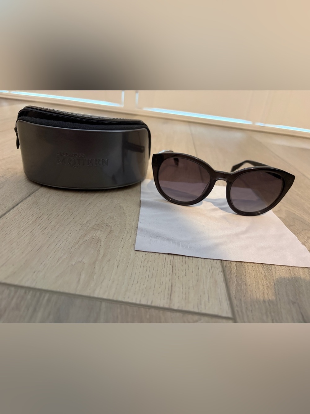 Alexander McQueen Black Cat-Eye Sunglasses with Skull Details